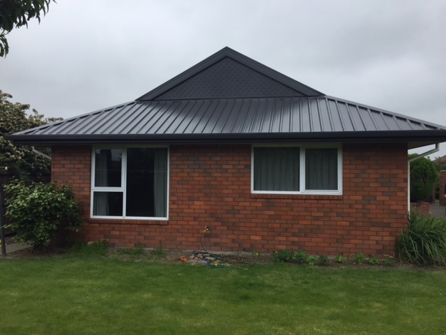 Canterbury Roof Coatings after picture with dark roof coating